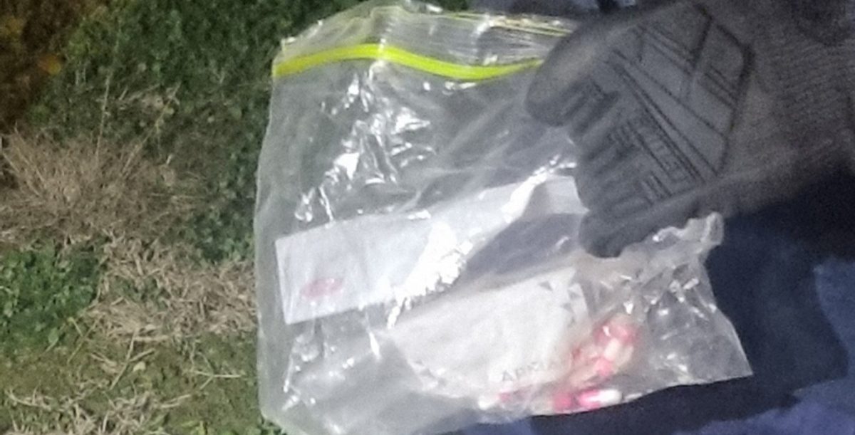 Police holding a bag during drug busts