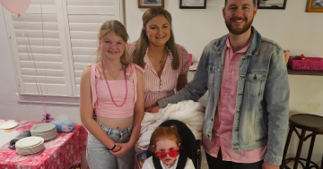 Little Alara rides a wave of support raising funds and awareness for childhood dementia
