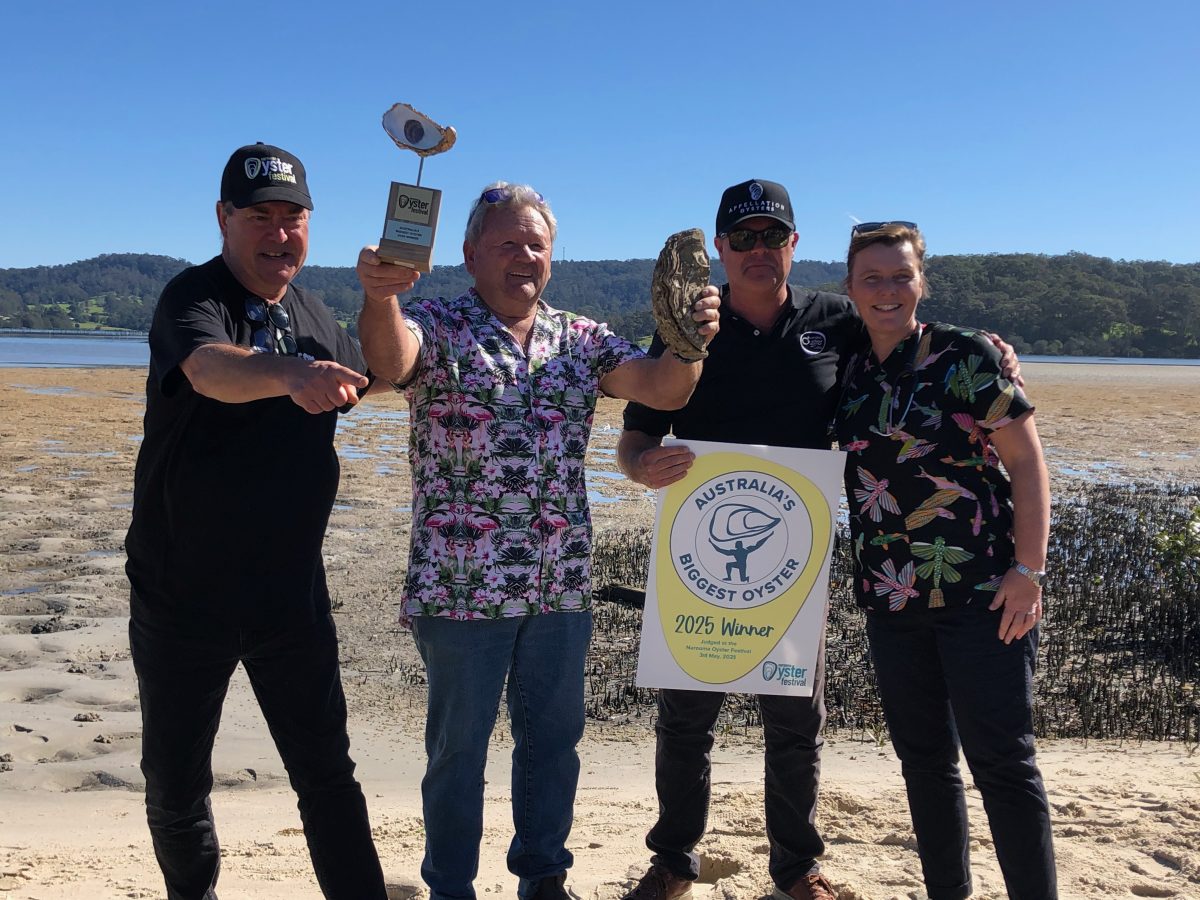 Australia’s Biggest Oyster Competition commentator Simon Marnie with Bernie Connell and his winning oyster 'Jack Junior', David Charlesworth of Australia’s Oyster Coast, and Dr Jayne Weller of Montague Vets at Narooma Oyster Festival on 3 May.