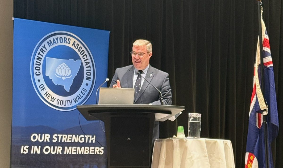 Mayor Rick Firman addressing a gathering of mayors
