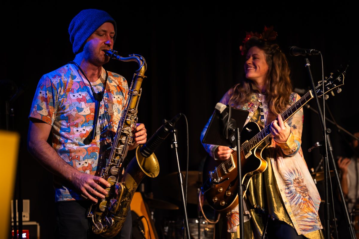 two musicians playing on stage