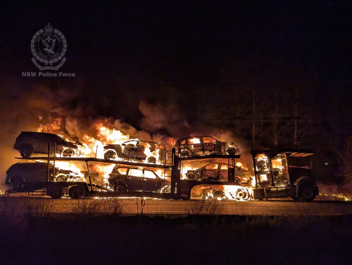 Burning cars on a transport vehicle