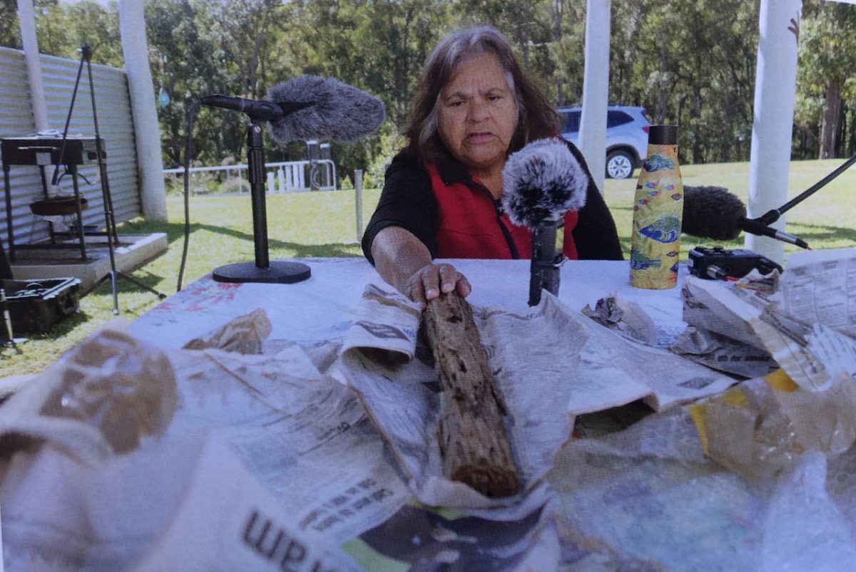 Aunty Loretta Parsley unwraps a fence post split by Jimmy Governor, her great-grandfather.