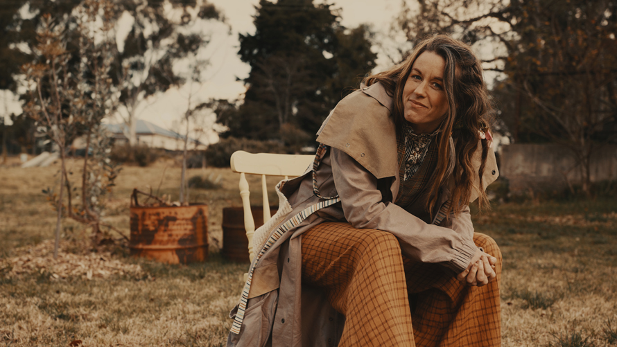 woman sitting on a chair in the country