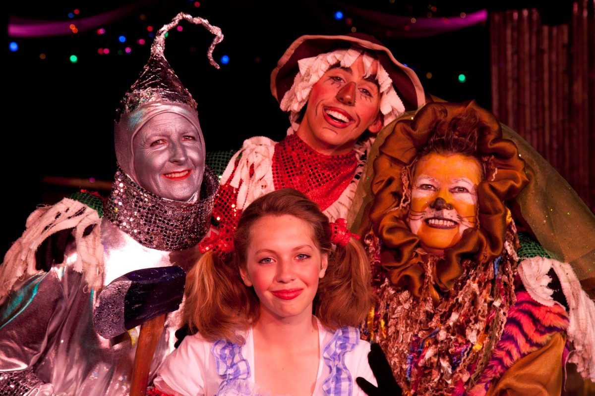 A group of stage actors dressed as characters from The Wizard of Oz.