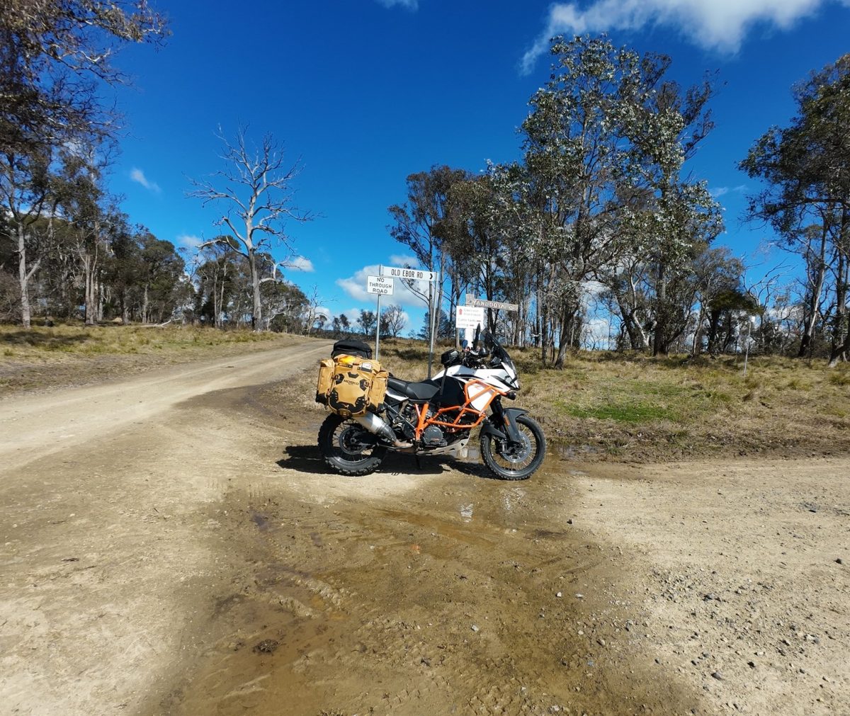 A motorbike on a dirt country road
