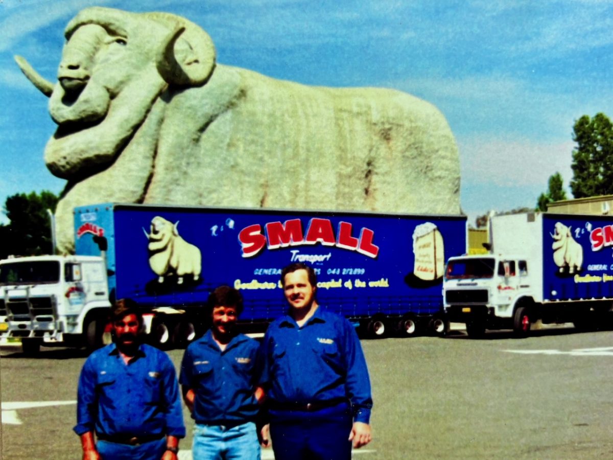 Ken Wray, Robert Small and Ray Haynes in front of the Small trucks with the distinctive Big Merino theme.