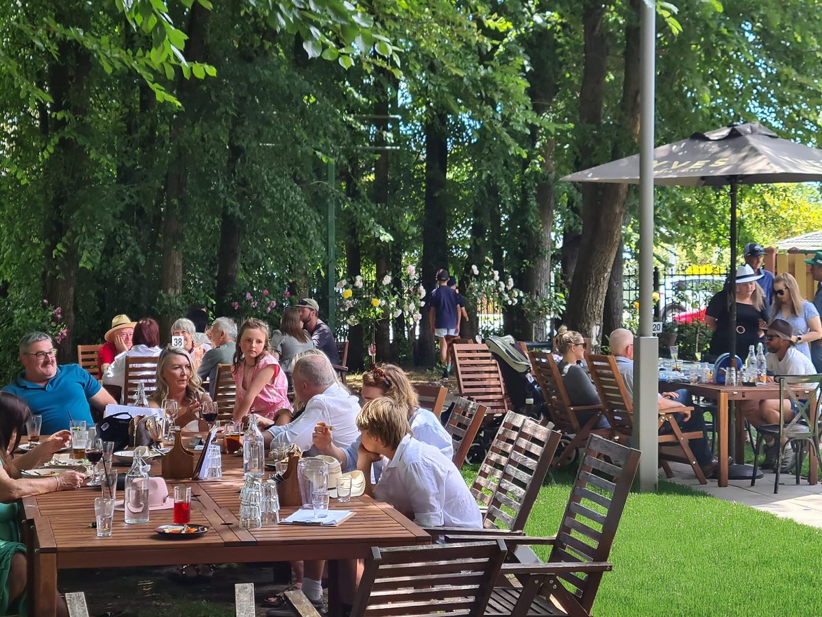 People dining outside in a beer garden