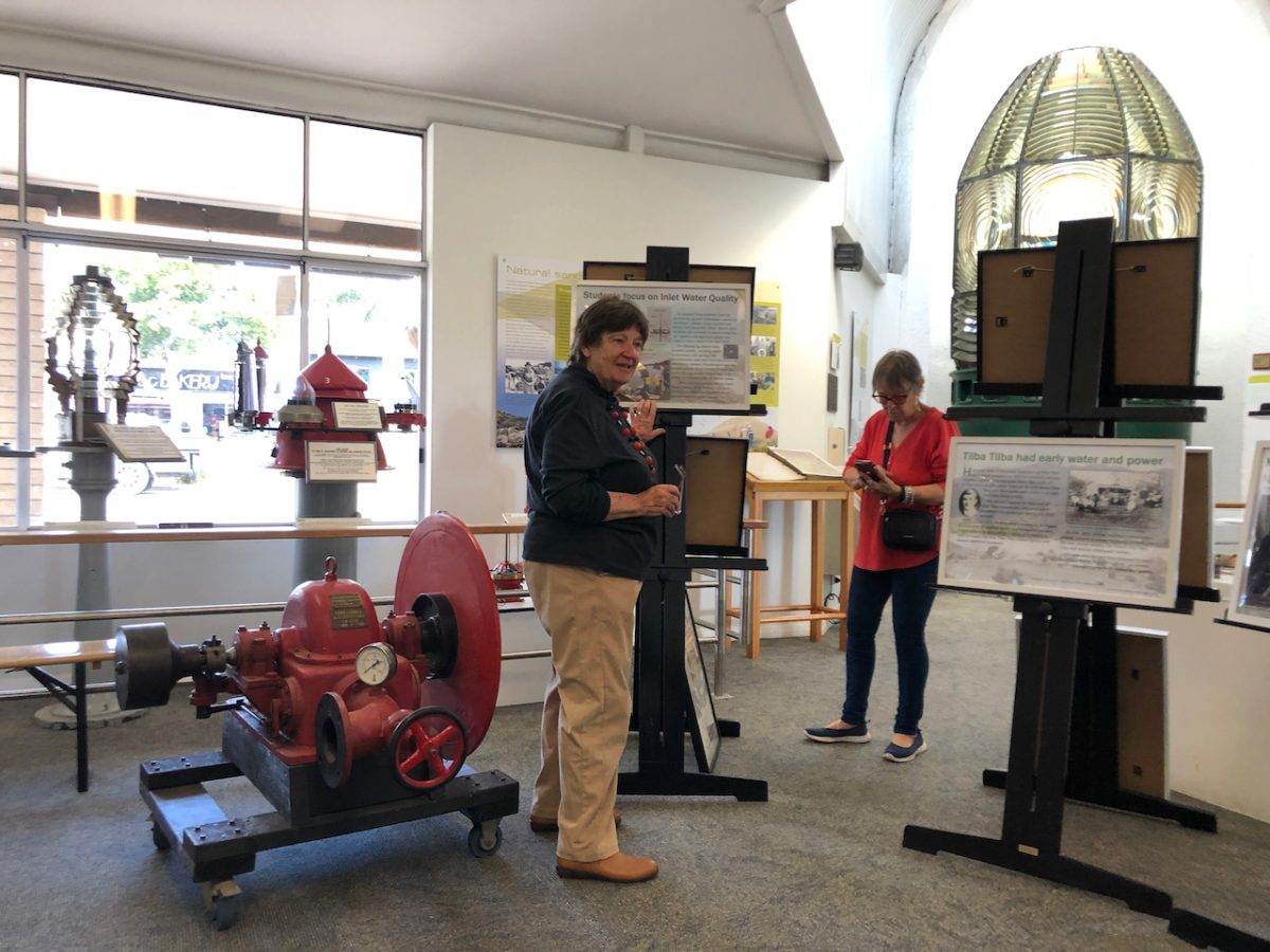 people at a history group display