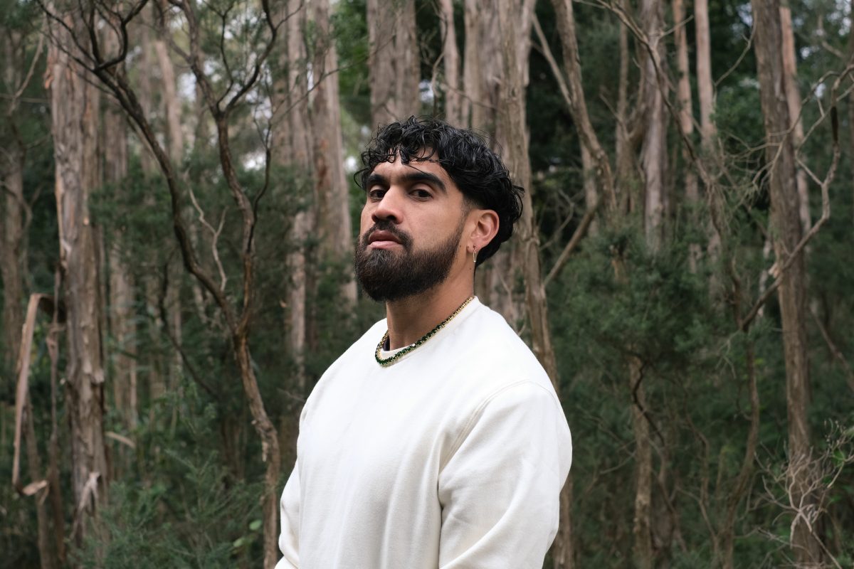 man standing near trees