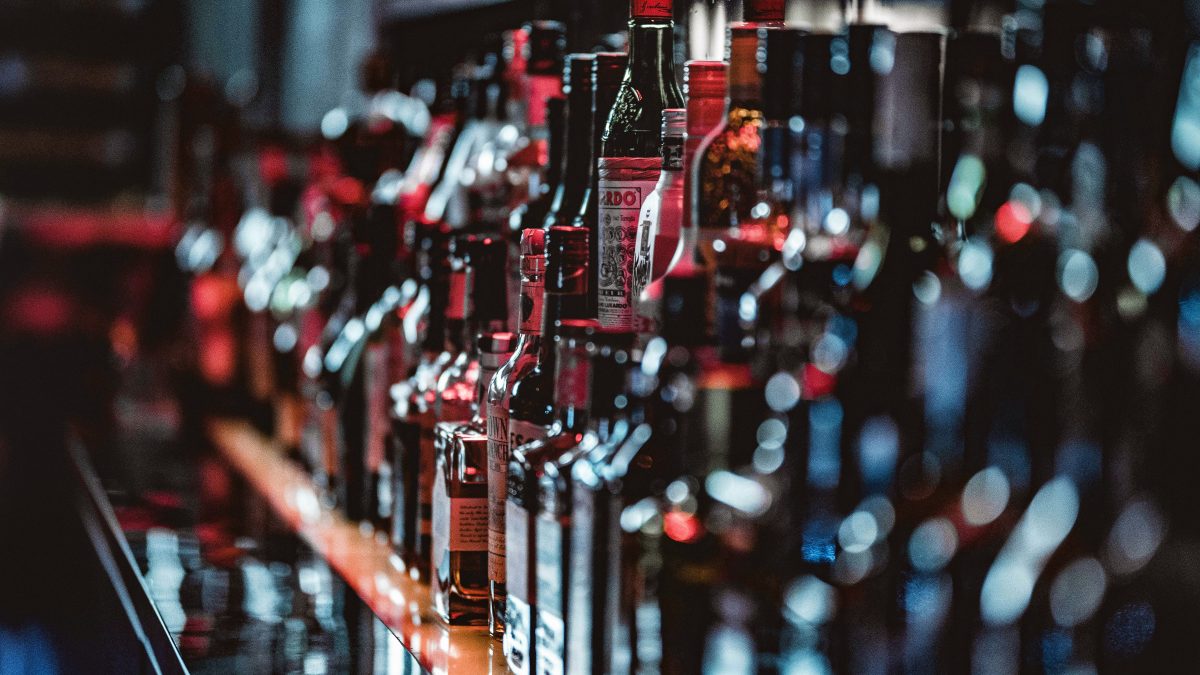 bottles of alcoholic drinks at a bar