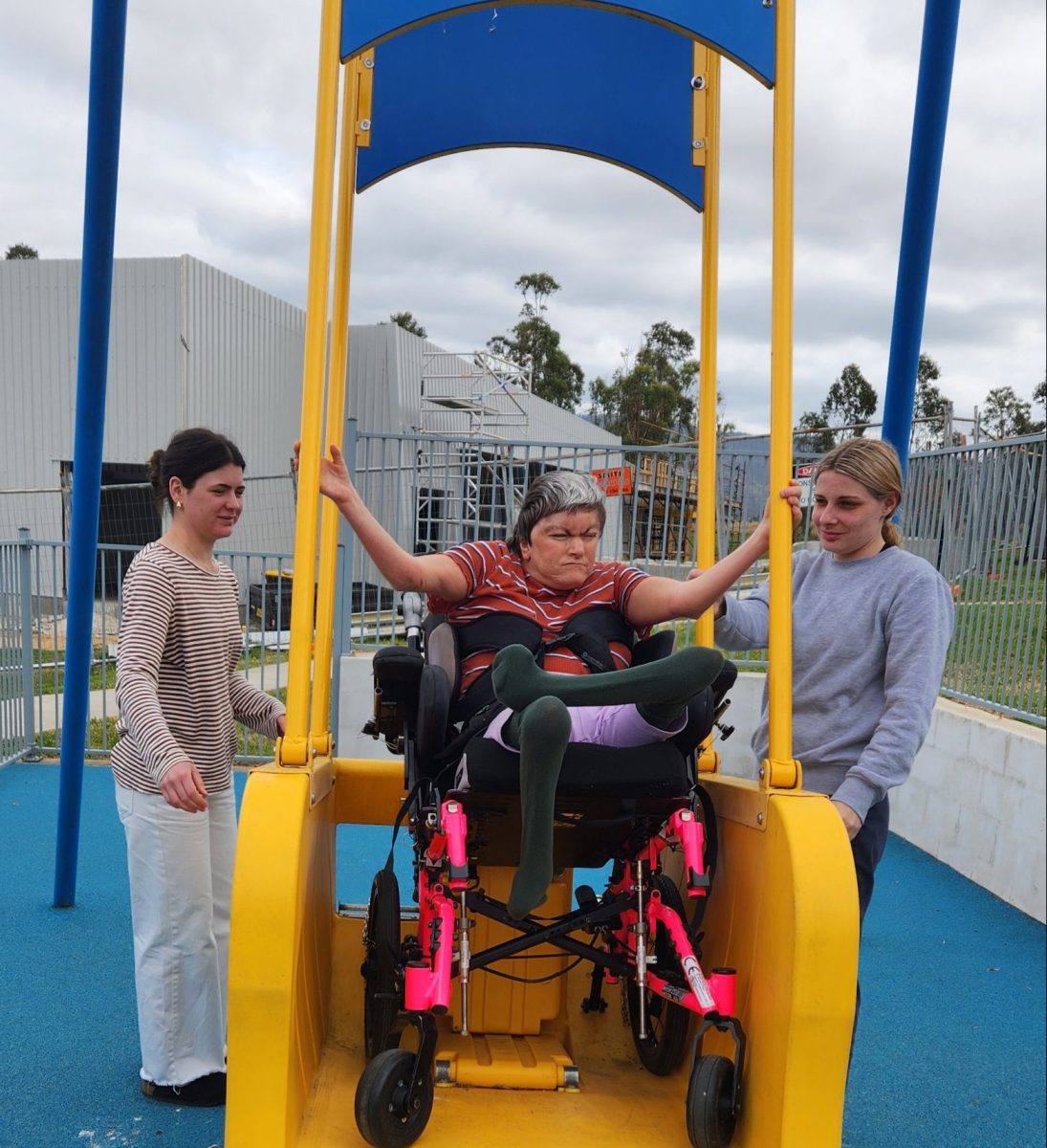 a disabled person with two carers