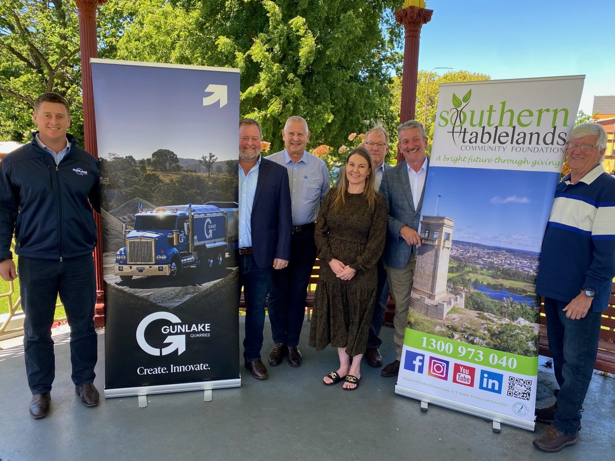 Group standing among banners