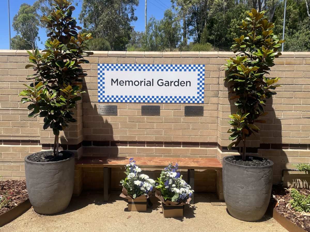 A bench and several plants mark a new place to commemorate fallen police staff. 
