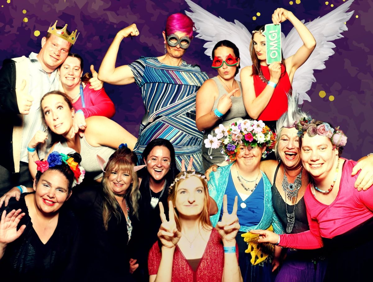 group of people hamming it up in fancy dress outfits