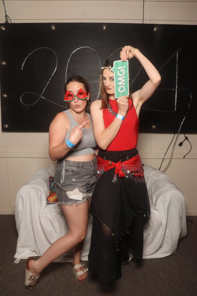 two young women in fancy dress outfits