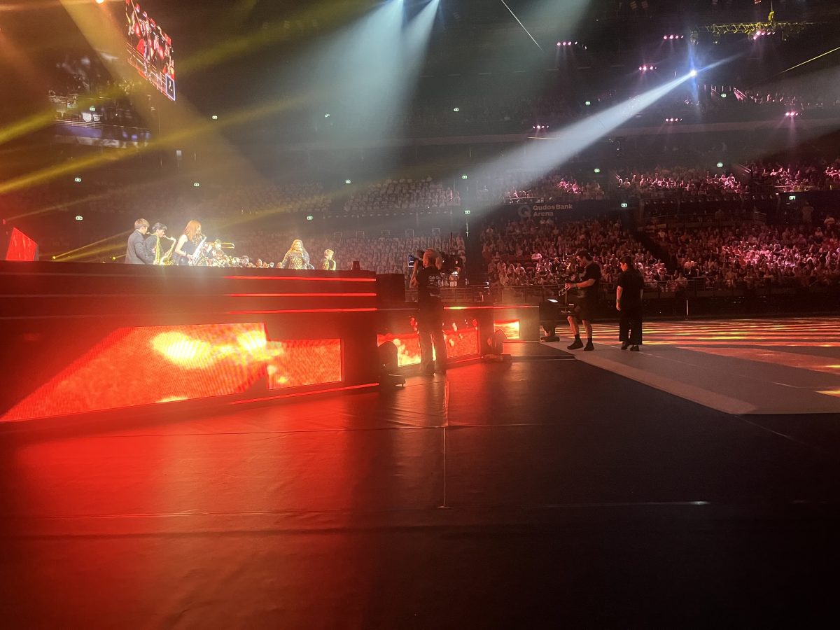 Small flames near the stage as part of a pyrotechnics display during a show