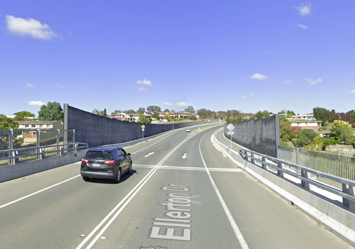 A car driving along Ellerton Drive, entering a section with noise walls