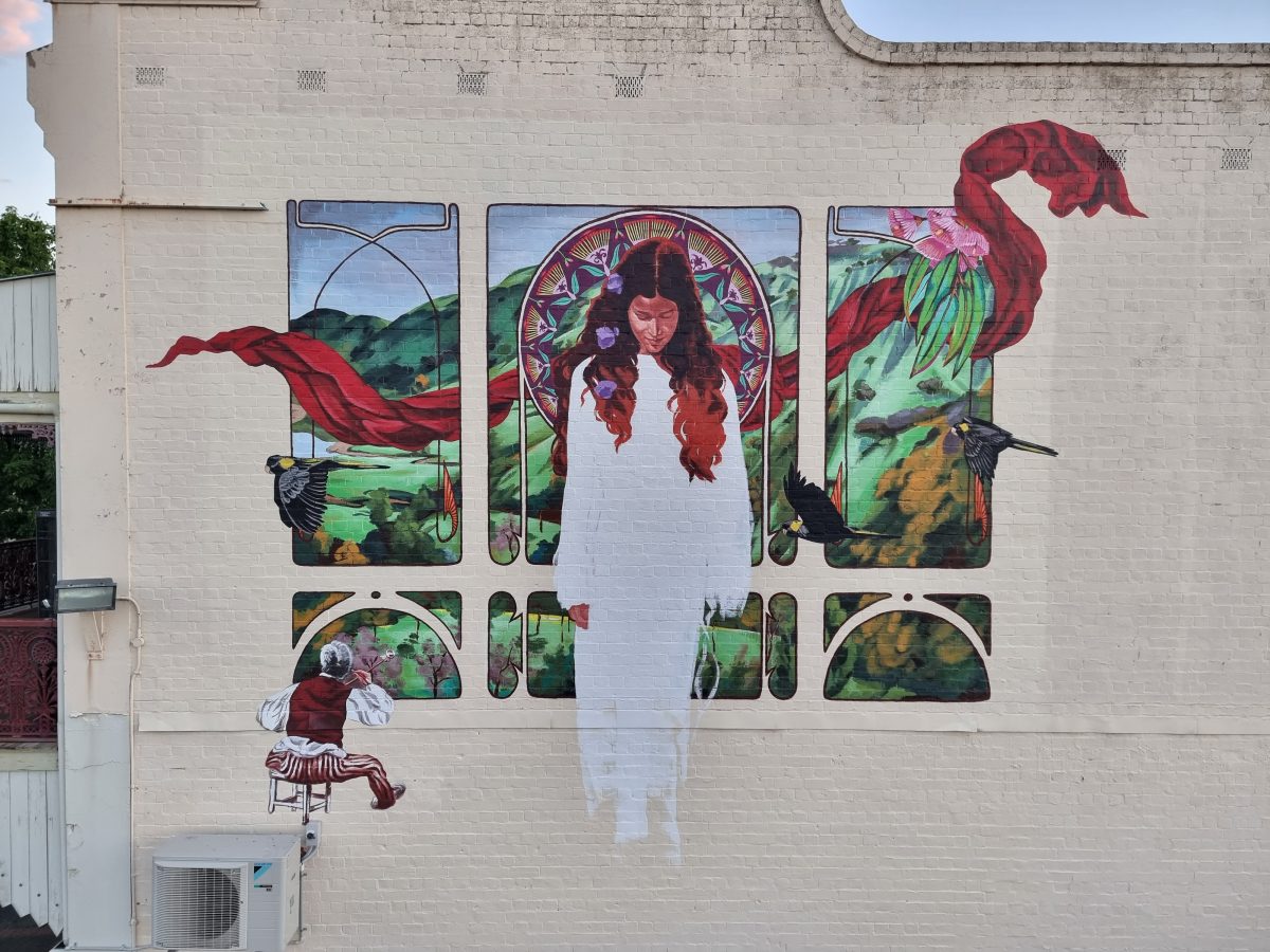 Mural of a girl in white dress