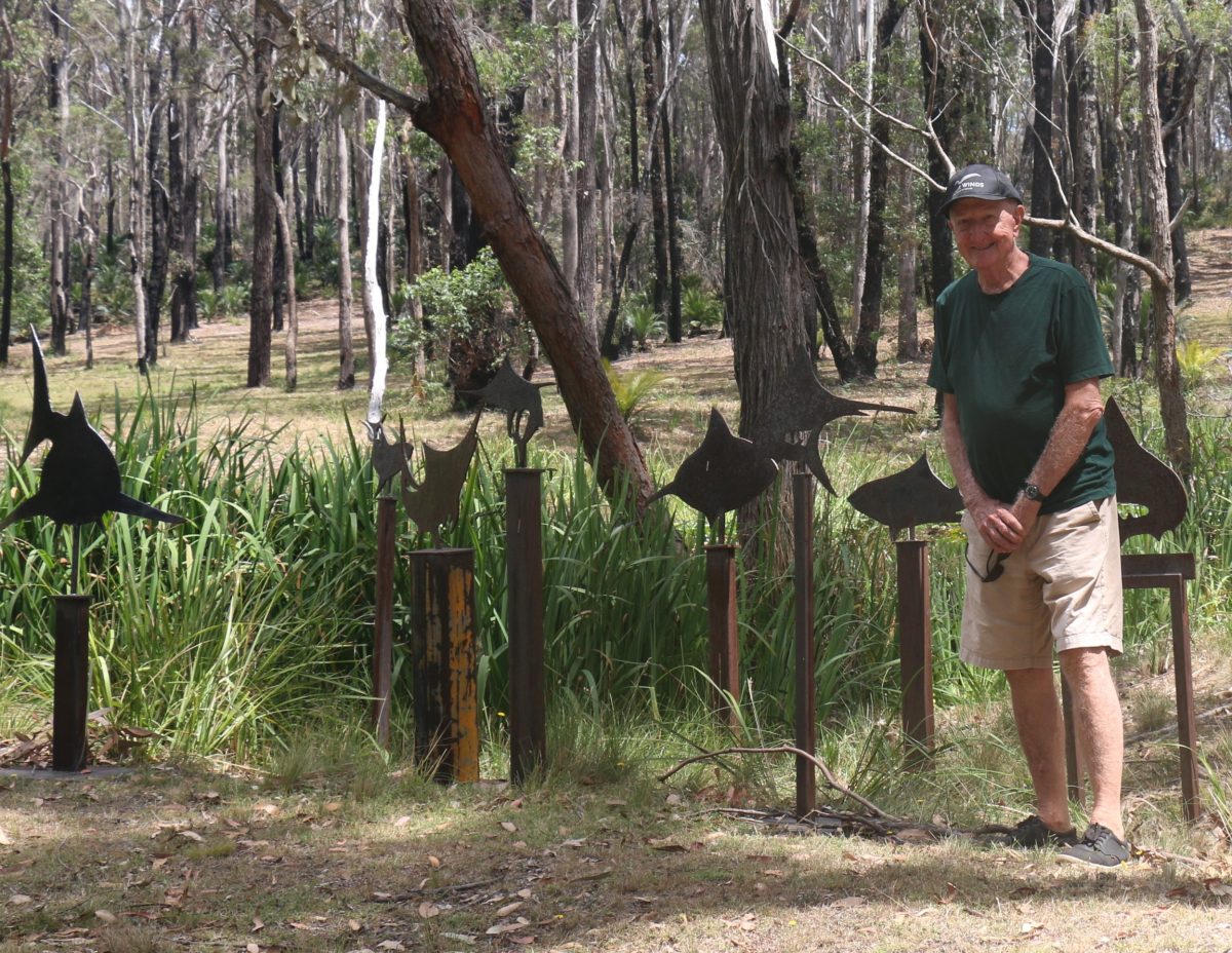 Philip Cox at his property with a sculpture by David Doyle. 