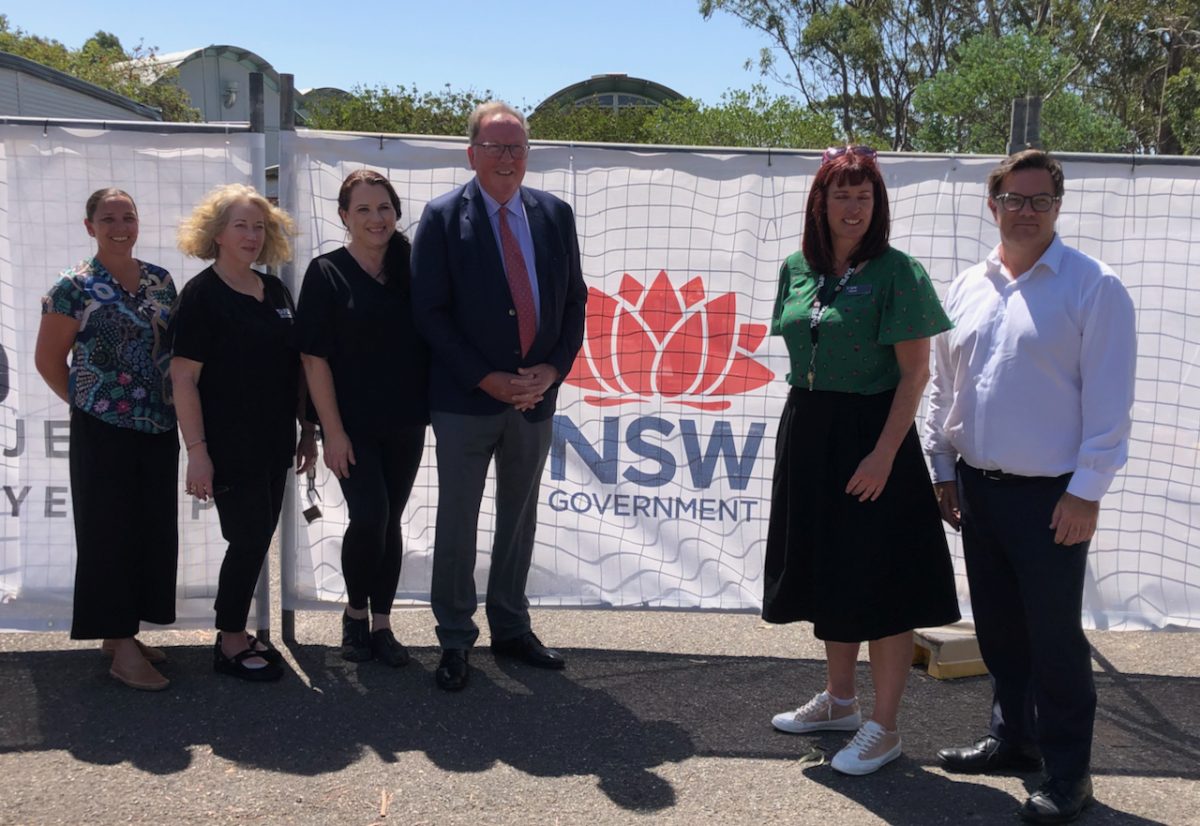 Member for Bega Dr Michael Holland with staff from NSW TAFE Moruya outside the construction site of new nursing facilities.