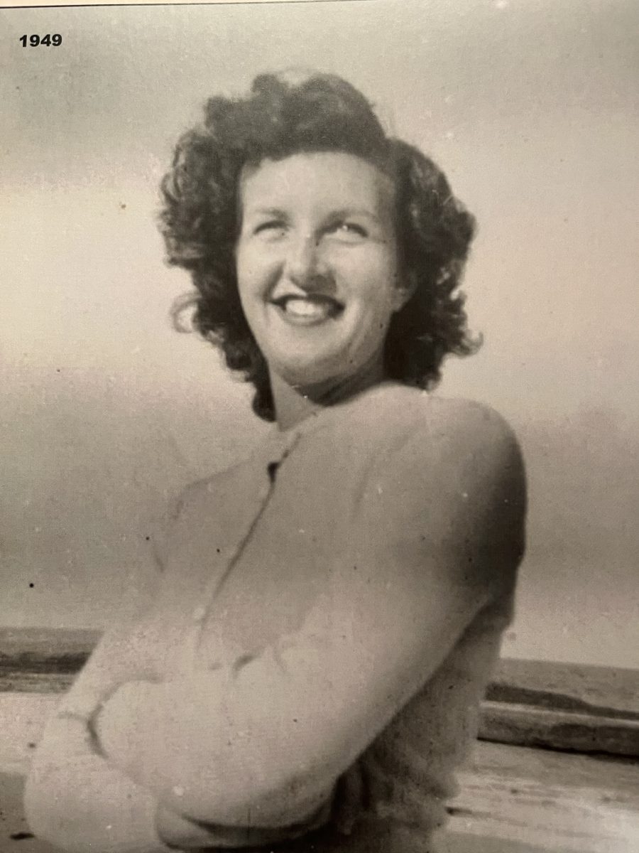Black-and-white shot of a smiling woman