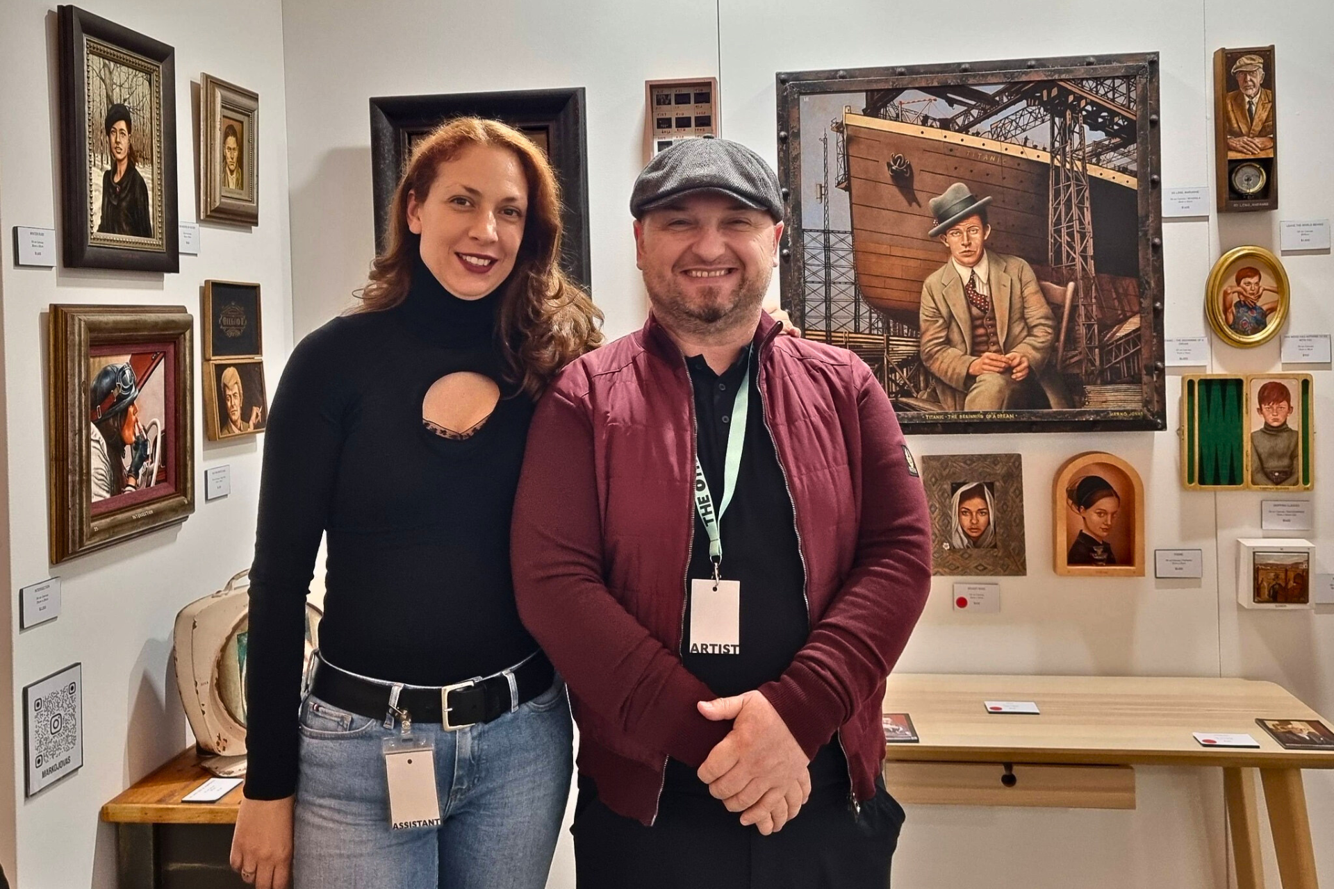 Man and woman standing in front of art display.