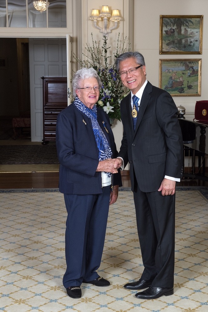 Woman shaking hands with man in suit