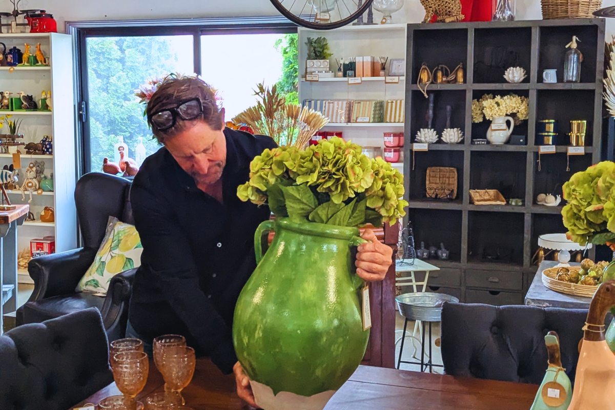Man places urn on a table