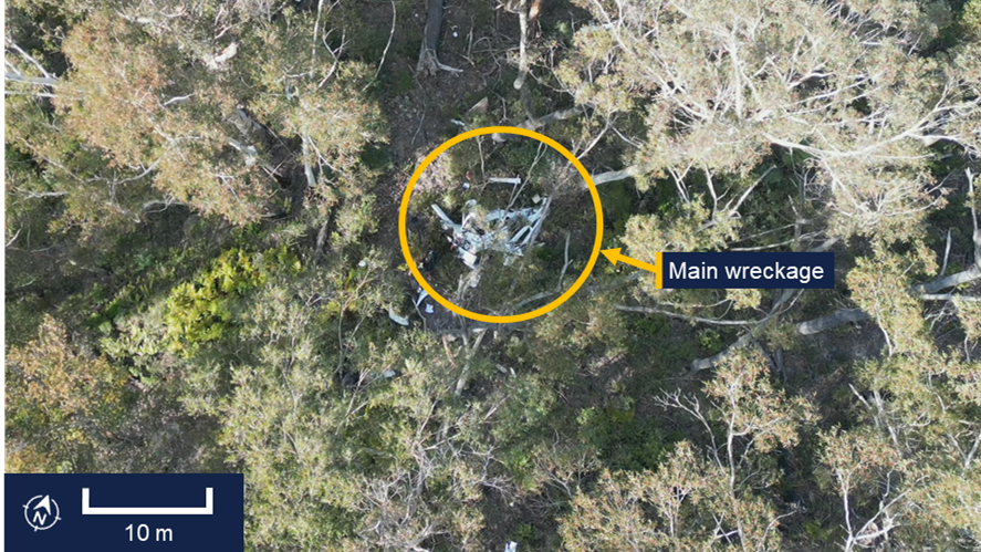 An image showing the crash site, with the main wreckage of the plane circled in yellow