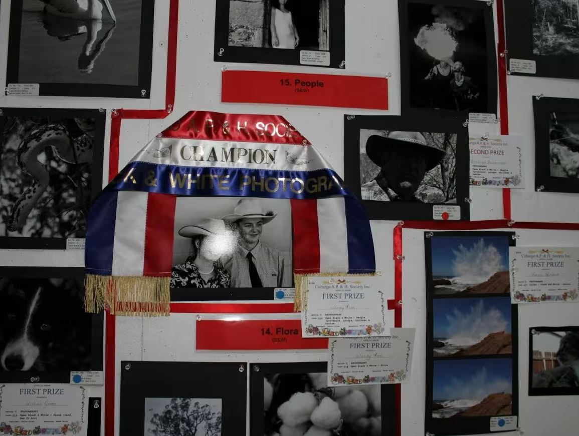 display of photos, awards and competition ribbons