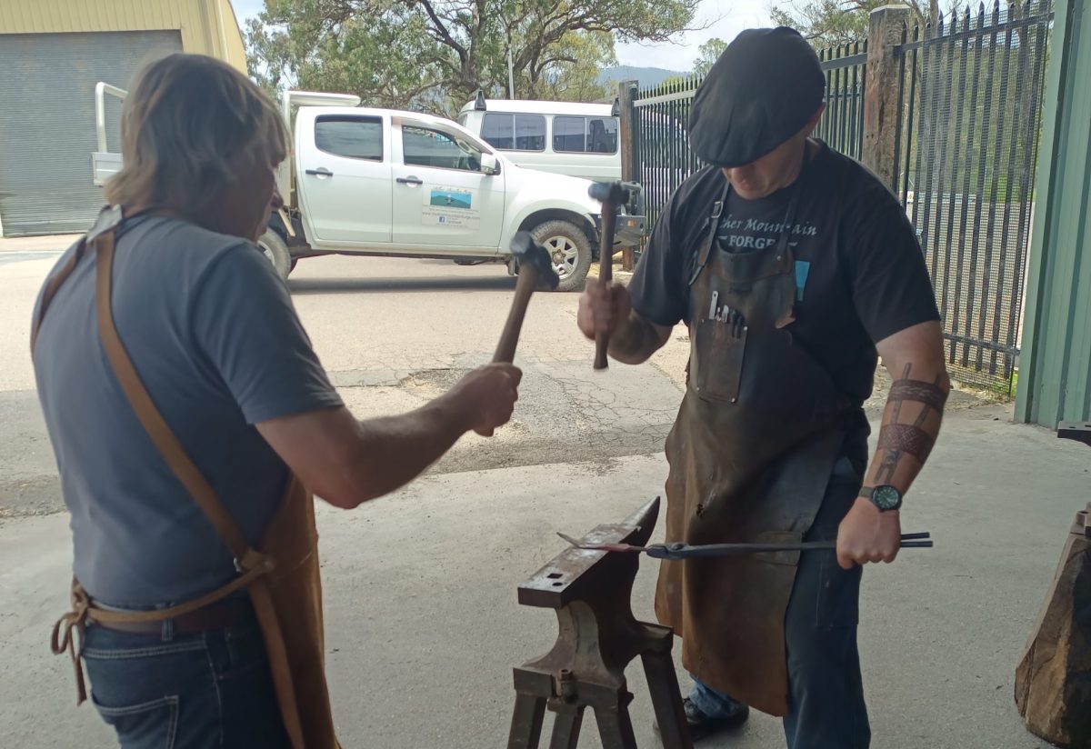 Iain Hamilton of Mother Mountain Forge (right) with Dave Bennett.