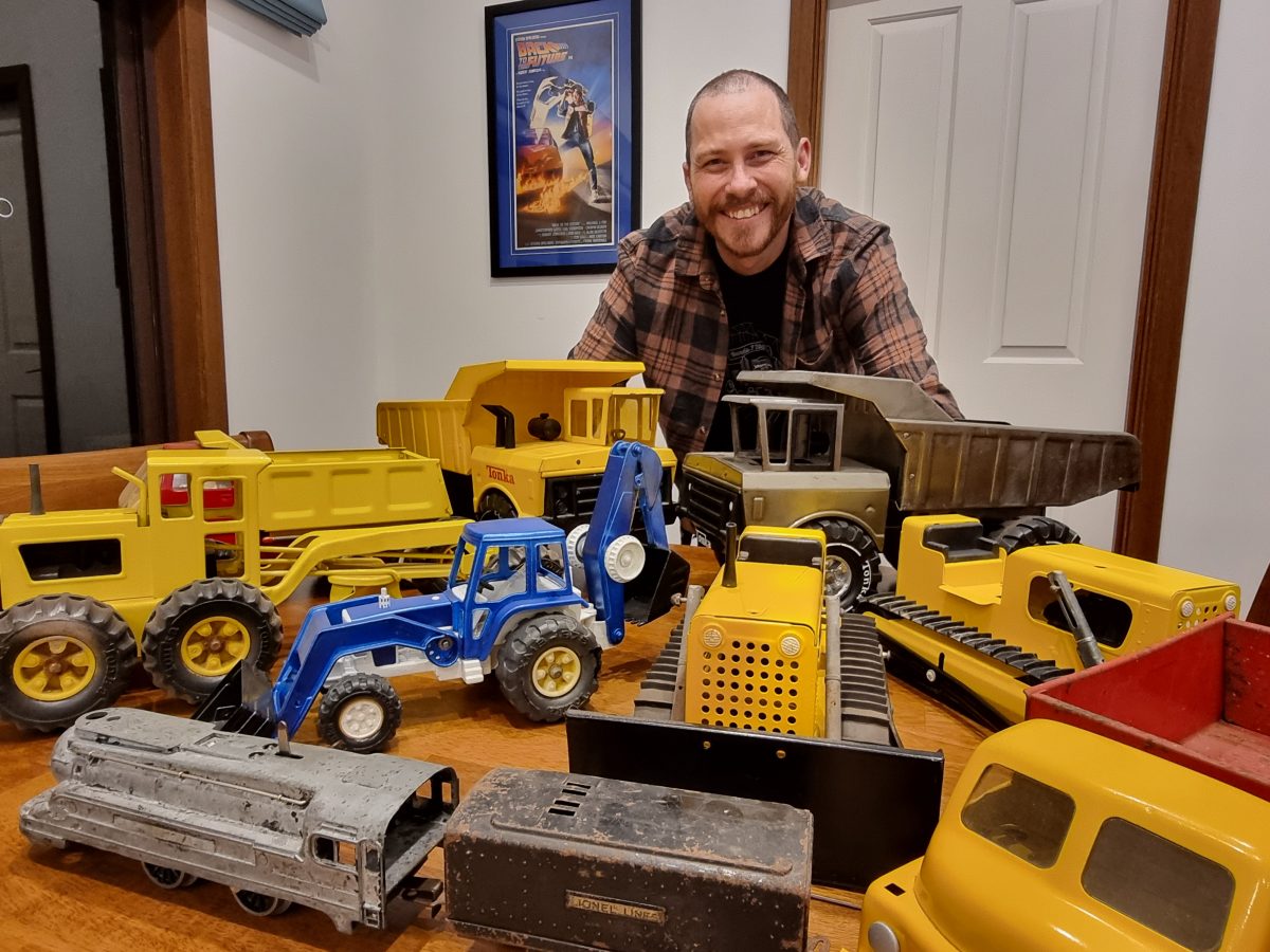 man and toy trucks