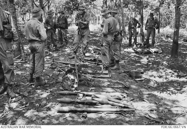 Soldiers gathering weapons