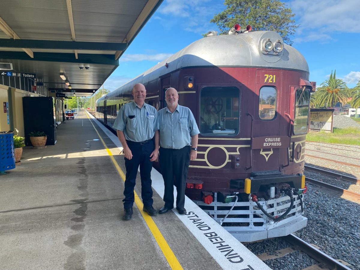 Staff on platform near train.