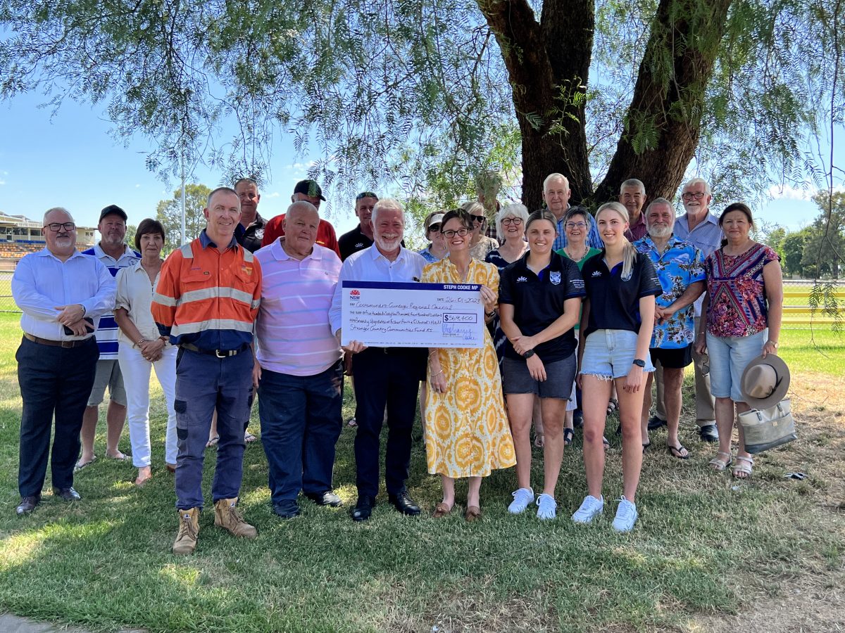 group cheque presentation in park