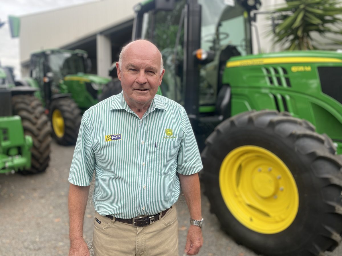 man in front of tractors