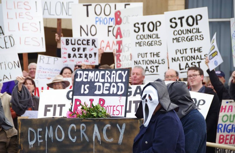 The Coalition government's forced council amalgamations sparked statewide protests.