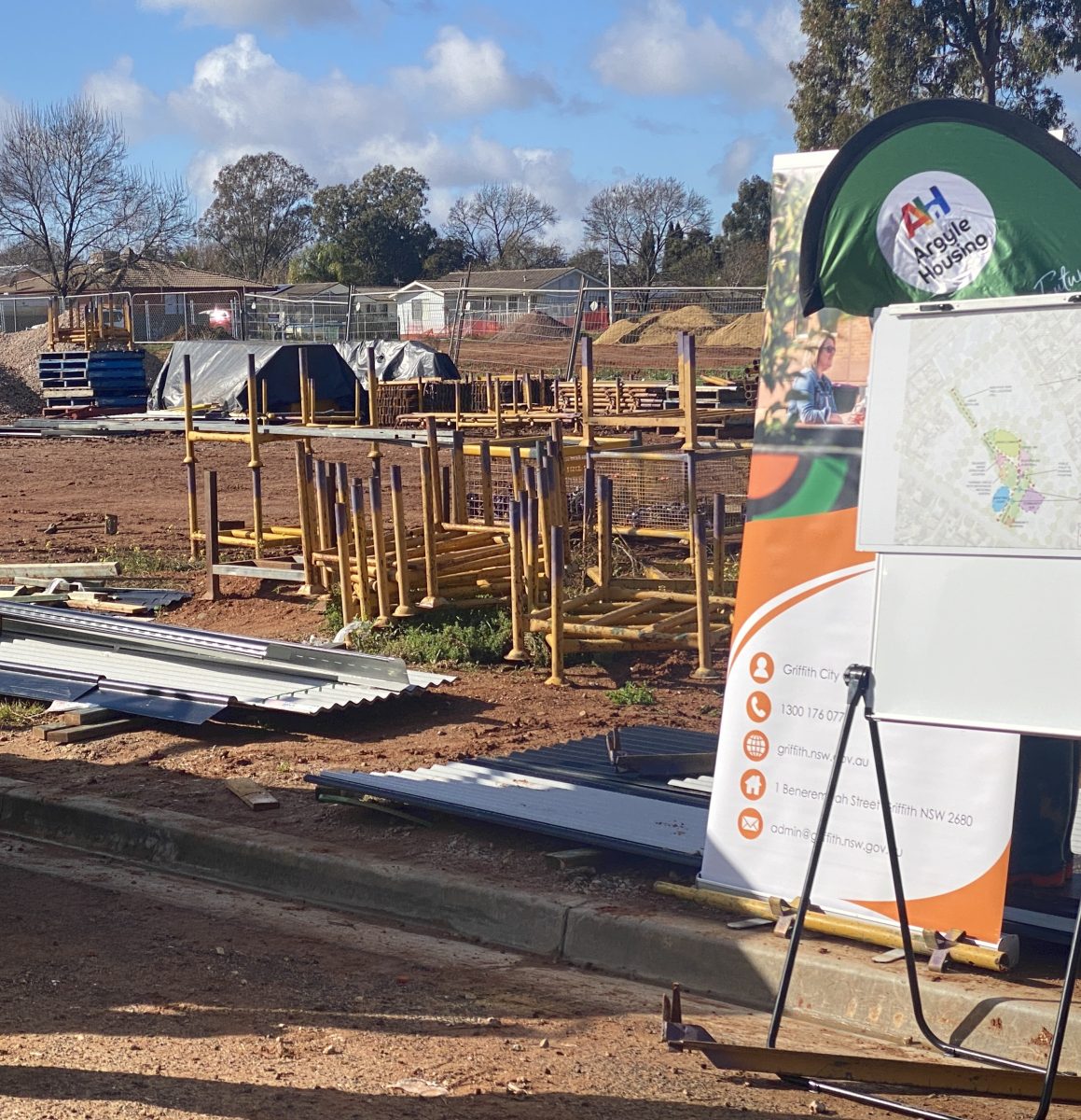 A construction site with Argyle Housing sign 