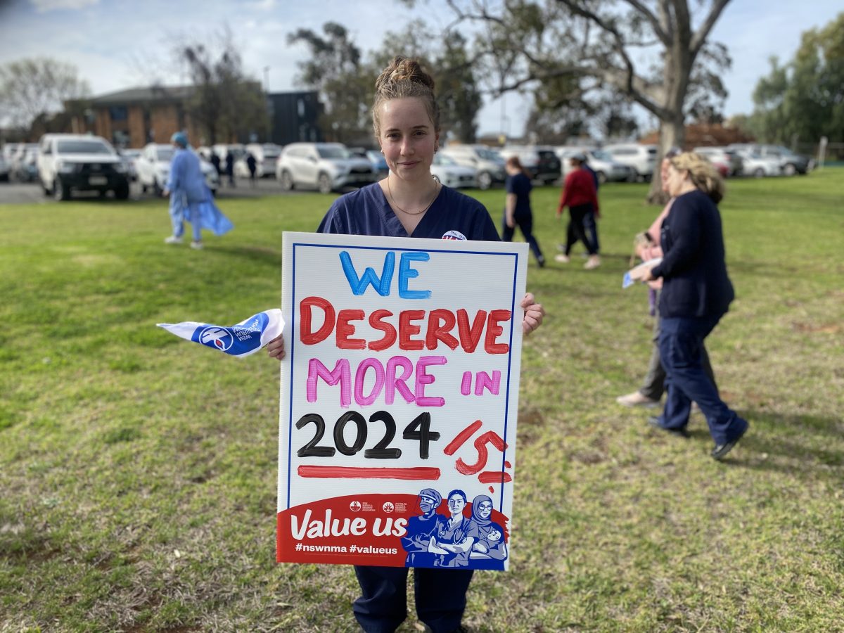 Nurse holding sign 