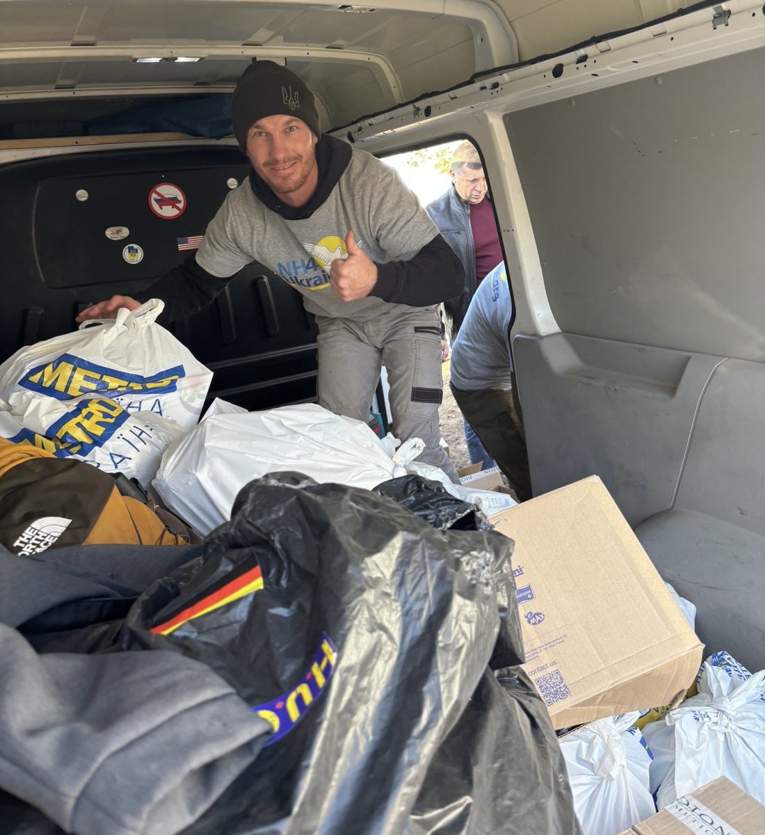 Ethan in truck with supplies