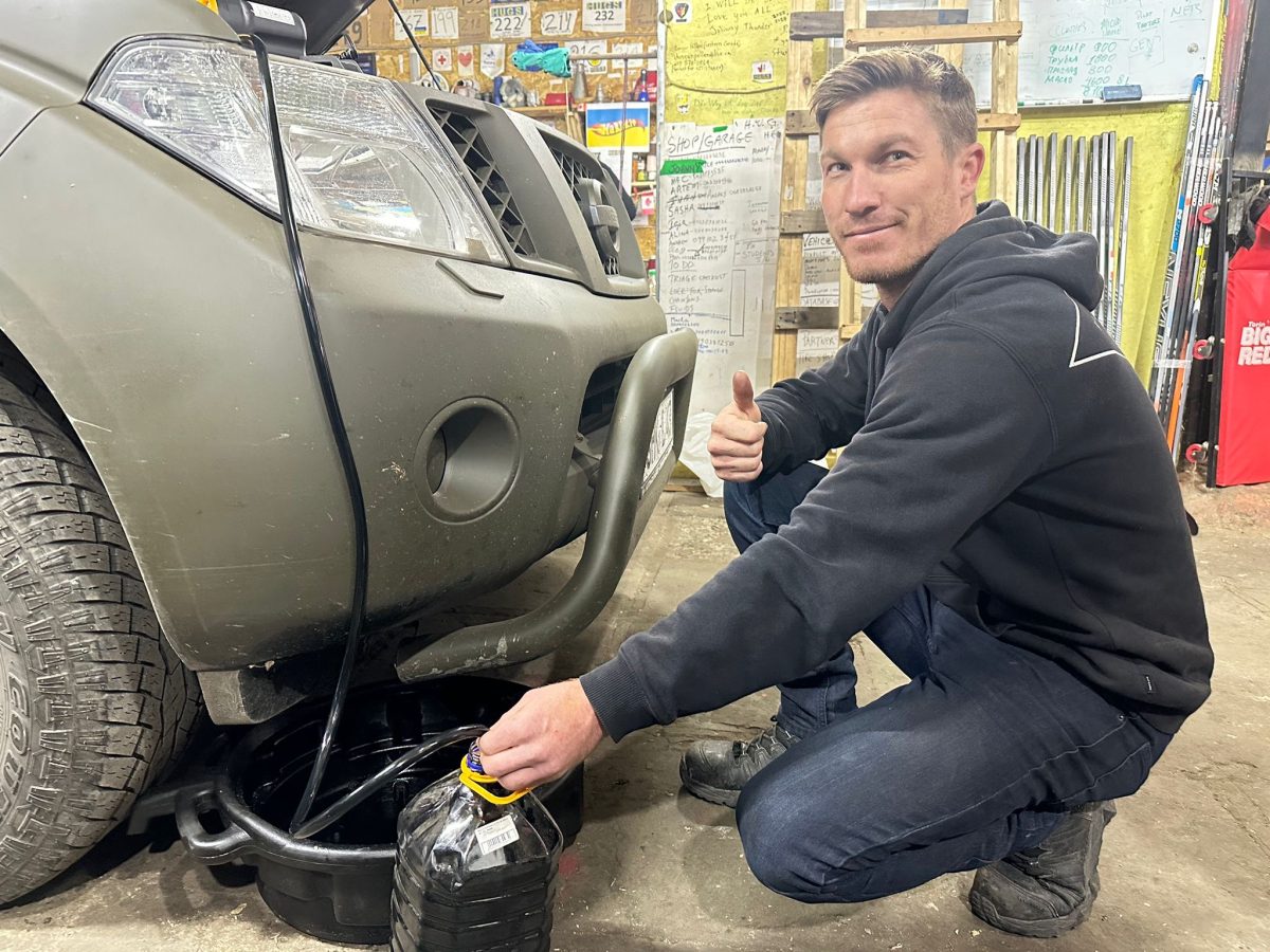 Ethan Byrne fixing car