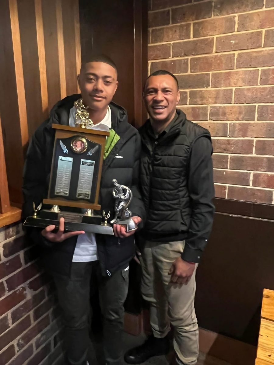 Tevita and son with trophies 