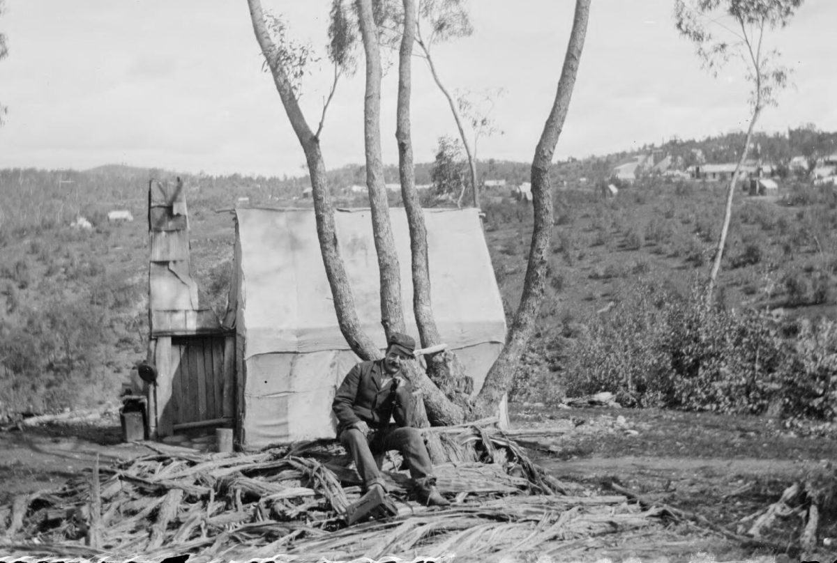 A gold miner sitting outside his hut at the gold diggings in Gundagai.