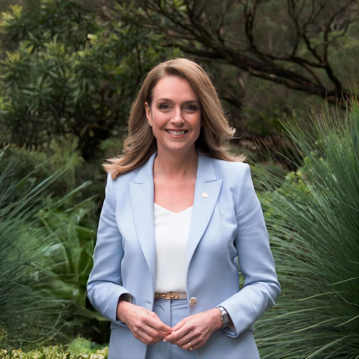 woman in front of trees